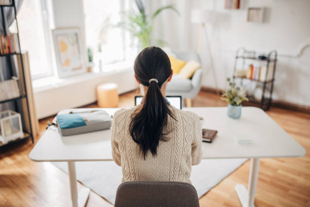 ergonomic desk setup with proper monitor height and chair positioning - posture correction chiropractor gresham oregon